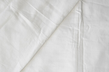 White sheet background. Top view pleated fabric texture