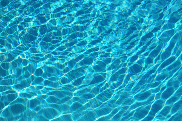 Fototapeta na wymiar Ripple blue water in swimming pool