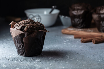 Chocolate muffins with crispy top. Selective focus. Copy space.