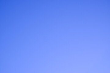 Plain blue background. Clear, deep cloudless sky.