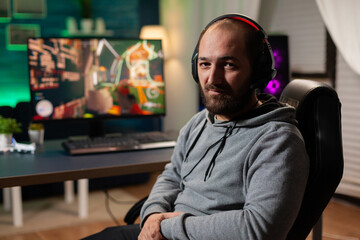 Fototapeta premium Woman gamer winning videogames with vr headset on powerful computer with professional joystick. Virtual online streaming cyber performing during game tournament using modern equipment.