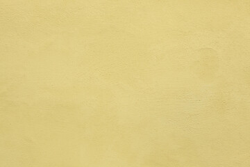 Fototapeta na wymiar Yellow painted stucco wall. Background texture
