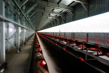 metal hangar with conveyor and rubber belt