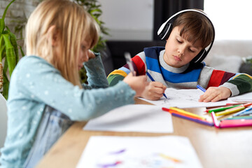 Fototapeta premium Brother and sister doing homework together
