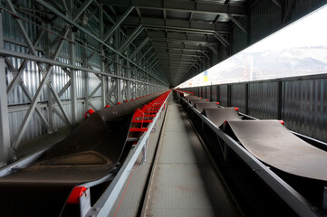 metal hangar with conveyor and rubber belt
