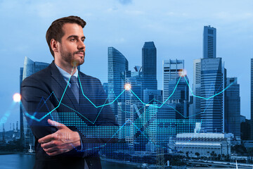 Young European handsome businessman in crossed arms pose pondering about new approaches to...