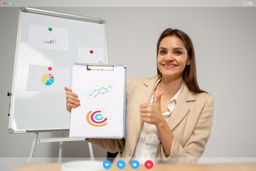 Obraz na płótnie Canvas Presenting graphs. Young woman working in videoconference with co-workers at office or living room. Online business, education during quarantine. Work, finance, tech concept. PC screen interface.