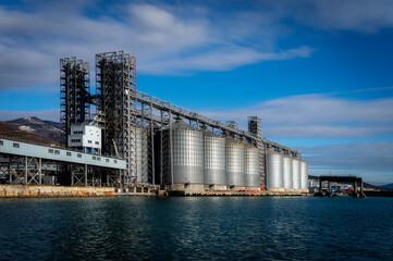 grain storage tanks in the port by the sea