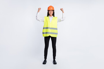 Photo of strong lady raise two hands show muscle wear helmet shirt vest pants shoes isolated white color background