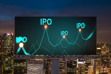 IPO icon hologram on road billboard over night panorama city view of Singapore. The hub of initial...
