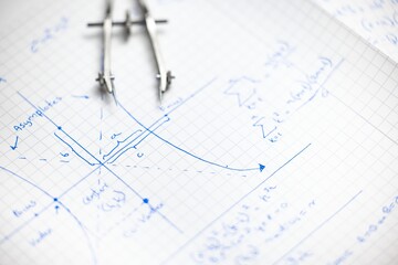 Math exersize in white notebook closeup