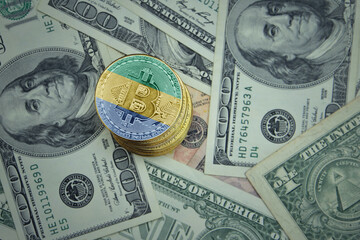 golden shining bitcoins with flag of gabon on a dollar money background.