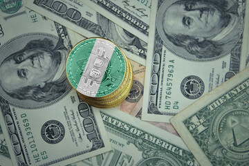 golden shining bitcoins with flag of nigeria on a dollar money background.