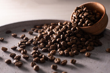 Fototapeta premium Coffee beans in a wooden cup