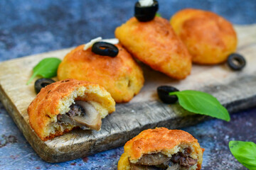 Fresh baked home made  mushroom  muffins Patties filled with mushrooms and minced meat.