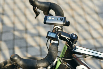 Close up shot of professional bike handlebar with equipment and accessories