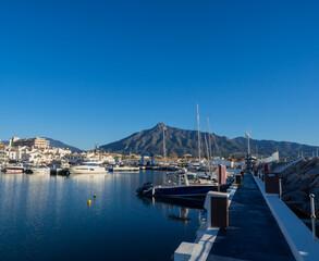 Puerto Banus with the mountains of Sierra Blanca at background, Marbella, Costa del Sol, Malaga province, Spain