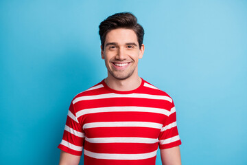 Photo of cute charming sweet man wear red outfit smiling isolated blue color background