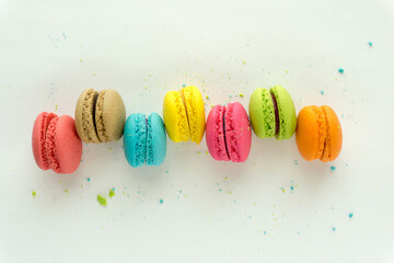 Mixed of Colorful Macarons cake on white background with copy space. Sweet and colorful french macaroons on white background.	