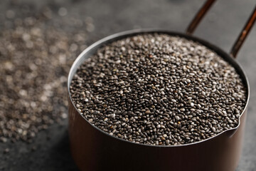 Saucepan of chia seeds on table, closeup