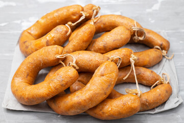 typical portuguese smoked sausages alheira on ceramic background