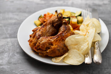 typical portuguese smoked sausage alheira with chips and greens
