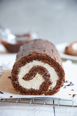 Sweet roll with wiped cream, delicious chocolate cake
