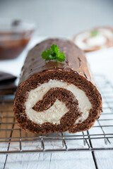Sweet roll with wiped cream, delicious chocolate cake
