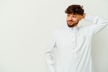 Young Moroccan man wearing a typical arab clothes isolated on white background touching back of head, thinking and making a choice.