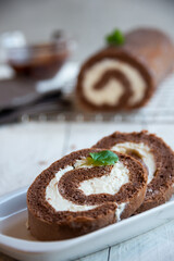 Sweet roll with wiped cream, delicious chocolate cake
