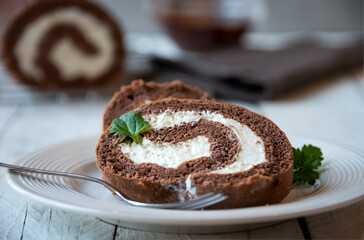 Sweet roll with wiped cream, delicious chocolate cake