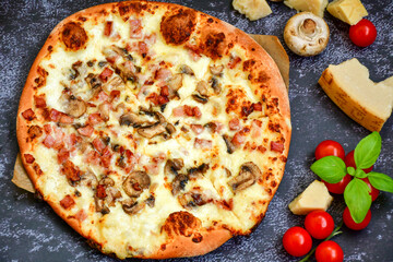 Tasty hot italian carbonara pizza with ham, bechamel sauce,mushroom,tomatoes  and cheese. Pizzeria menu. Concept poster for Restaurants or pizzerias. Top view