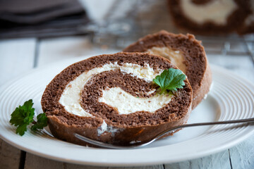 Sweet roll with wiped cream, delicious chocolate cake
