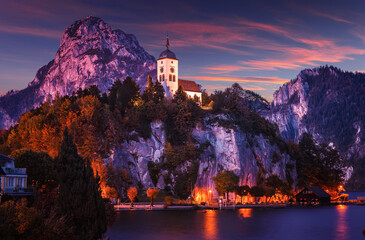 Wonderful evening nature scenery. Chapel on a hill over the Traunsee lake in the Alps of Austria. Amazing nature landscape during sunset. Travel adventure concept. Colorful Natural background.