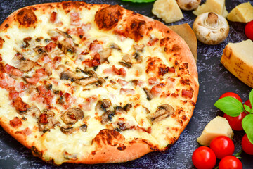 Tasty hot italian carbonara pizza with ham, bechamel sauce,mushroom,tomatoes  and cheese. Pizzeria menu. Concept poster for Restaurants or pizzerias. Top view