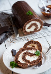 Sweet roll with wiped cream, delicious chocolate cake