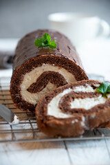 Sweet roll with wiped cream, delicious chocolate cake