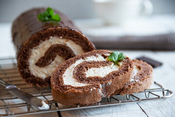 Sweet roll with wiped cream, delicious chocolate cake