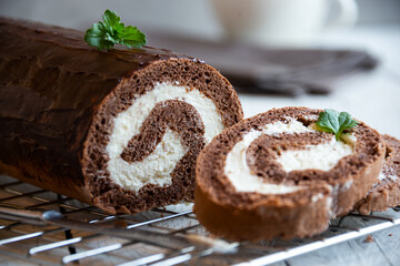 Sweet roll with wiped cream, delicious chocolate cake