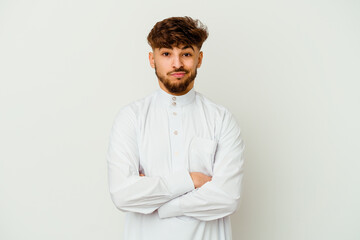 Young Moroccan man wearing a typical arab clothes isolated on white background unhappy looking in...