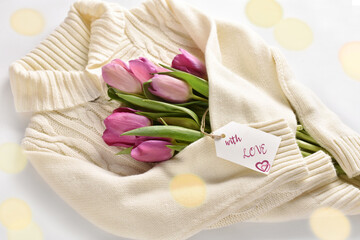 tulips wrapped in a warm wool sweater with love words on paper label