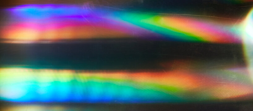 Blurred Rainbow Flare with Vintage Effect on Film. Dust and scratches. Overlay Bokeh Light Leaks Retro Reflection. Abstract blurred glittering shine background and colorful flare.