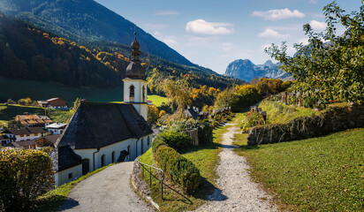 Scenic image of nature landscape. Wonderful sunny autumn scenery in Bavarian Alps. famous Parish Church of St. Sebastian in Ramsau in falltime, Nationalpark Berchtesgadener Land,  Bavaria, Germany