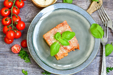 Home made italian lasagna pasta  bolgonese with tomato sauce and basil