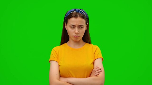 Crying like a little child. Upset girl keeps arms folded, puffed out her cheeks, angry, nervous, wipes her tears with her fists. Alpha channel