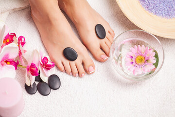 Obraz na płótnie Canvas Closeup photo of a female feet at spa salon on pedicure procedure