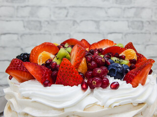 Anna Pavlova cake, cream and a variety of fruits. Strawberry, raspberry, currant, kiwi, jarberry, pomegranate!