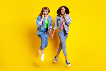 Fototapeta premium Full length photo of crazy ladies hands hold open mouth speak scream whisper isolated on yellow color background