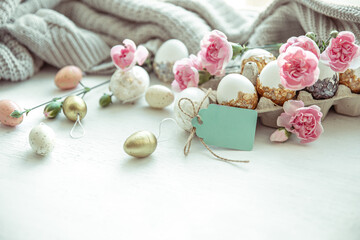 Festive easter composition with eggs, flowers and easter decor details copy space.