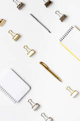 Office supplies background - paper binder clips top view